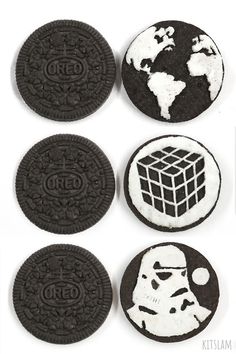 four oreo cookies with the image of darth vader and storm trooper on them