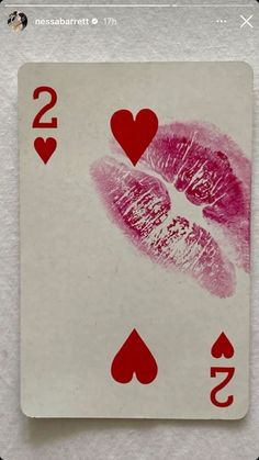 a playing card with two hearts on it