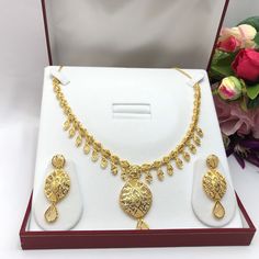 "Handmade Indian Bridal Wedding Jewelry 22ct Heavy Gold Plated Necklace Set with Earrings Indian Jewelry Indian Bollywood Jewelry , its Artificial Jewelry  Type :22ct Gold Plated Necklace Set Earrings Length: 2\"inches Approx Shape - As Shown in Picture It is a perfect match with formal attire on special occasions or with casual wearing Comes in Jewellery Gift Box Traditional Indian Wedding Jewellery Slight Colour variations possible due to difference in screen and photograph Care instructions K 22k Gold Yellow Necklaces For Wedding, 22k Gold Yellow Necklace For Wedding, Yellow 22k Gold Necklace For Wedding, Yellow 22k Gold Jewelry For Wedding, Yellow 22k Gold Wedding Jewelry, 22k Gold Round Temple Necklace For Wedding, Gold Plated Yellow Wedding Jewelry, 22k Gold Bridal Necklace For Anniversary, Yellow Gold Plated Wedding Jewelry