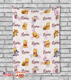 winnie the pooh baby blanket on a brick wall with name and images printed on it