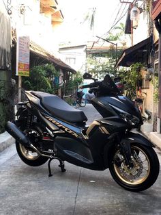 a black motorcycle parked on the side of a street