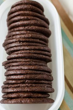 chocolate cookies in a white dish on a table