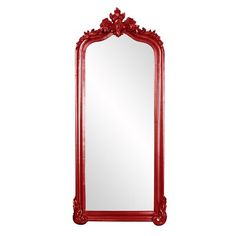 a large red mirror sitting on top of a white wall next to a wooden frame