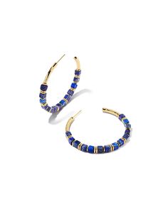 Good news – the Ember Gold Hoop Earrings in Blue Lapis are just the pop of color you’re looking for. Crafted with custom-cut genuine stone beads, these one-of-a-kind earrings make for an elevated take on a classic silhouette. Metallic Powder, Blue Lapis, Brass Material, Gold Pendant Necklace, Jewelry Earrings Hoops, Gold Hoop, Bronze Color, Gold Hoop Earrings, Kendra Scott