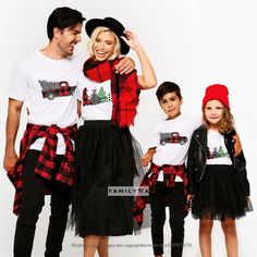 a man, woman and two children are dressed up in matching outfits for the holiday season