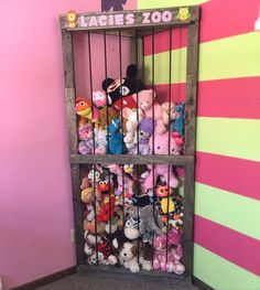 there are many stuffed animals in the jail cell