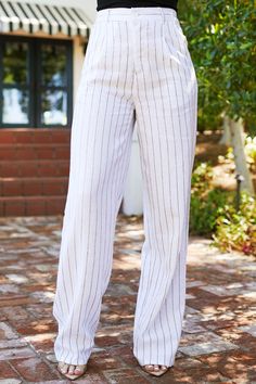 You won't find a better spring-summer pant anywhere else! The Carina Blue Striped Pants are the pants of the season. Featuring a pinstripe fabric, two side pockets, two back welt pockets, a partially elastic waistband for an adjustable fit, a button zipper closure, belt loops, and a straight fit. Style with the Enid Tank Top to complete the look!