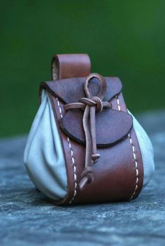 a small brown and white bag sitting on top of a table