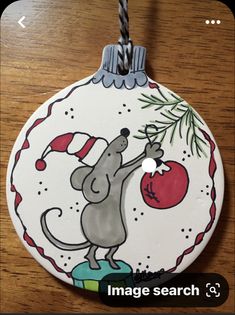 a christmas ornament with a mouse on it