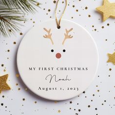 a personalized christmas ornament with reindeer's nose and stars around it