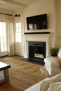 the living room is clean and ready to be used as a tv over the fireplace