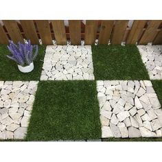 the grass is laid out in squares to look like it's made from stones