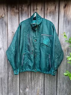 Green jacket for men or women. Sports vintage unisex jacket Made in Austria Lable size 48 Measurement: Length of the sleeve from the neck to the bottom of the sleeve 33 inches (84 cm) pit to pit: 27 inch, 69cm Jacket bottom 48 inches (122cm) Length 30 inches (76 cm) 90s Retro Clothing Affordable Green Nylon Windbreaker, Unisex Jacket, Women Sports, Jacket For Men, Retro Outfits, Green Jacket, Sports Women, Denim Button Up, Austria