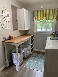 the laundry room is clean and ready to be used as a mudroom for children