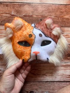 One of a kind, hand felted and colored therian mask. This purr-fect calico cat mask features fun fur, detailed eyes, and fun double set of ears. Kid sized mask is held on with elastic, contains a paper mache base coated in felt. Mask shown is the one you will receive. Cat Design Eye Mask For Masquerade, Masquerade Eye Mask With Cat Design, Masquerade Mask With Whiskers, Cat Design Eye Mask For Costume Party, Masquerade Cat Ears Mask With Whiskers, Halloween Cat Design Eye Mask, Cat Ears Masks With Whiskers For Masquerade, Cosplay Cat Design Mask, Cosplay Cat Design Eye Mask