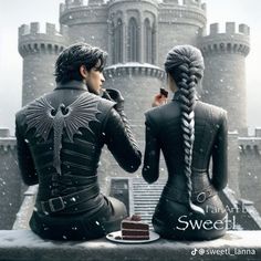 there are two people sitting on a bench in front of a castle and one is holding a piece of cake