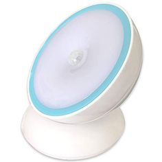 a white and blue light sitting on top of a table