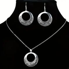 Attractive filigree round-shaped modern necklace and drop earrings set. To avoid tarnish, limit exposure to water, perfume, or body cream.

2-day processing. Shipped in 4-7 days. Silver Jewelry Sets As Elegant Gift, Silver Jewelry Sets For Gifts With Elegant Design, Silver Jewelry Sets As Gift With Elegant Design, Elegant Hypoallergenic Round Pendant Jewelry, Elegant Metal Medallion Jewelry, Elegant Hypoallergenic Alloy Jewelry, Elegant Engraved Circular Jewelry, Elegant Filigree Jewelry Sets, Nickel-free Alloy Jewelry Sets For Gifts