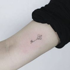 a person with a small tattoo on their arm