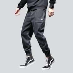 Take your fashion game to the next level with our 2023 Autumn Collection's street dark men's denim joggers! These monochrome. mid-waist joggers are perfect for making a statement. yet still keeping it comfortable and stylish. With their drawstring closure and stretchy fabric. they promise to keep you looking sharp even during the most intense streetwear looks.Why You'll Fall In Love Street Style: Make an impact with these joggers. designed to keep you looking your best no matter the season or oc Urban Tapered Leg Joggers For Streetwear, Casual Straight Leg Joggers For Streetwear, Casual Tapered Leg Joggers For Streetwear, Baggy Tapered Leg Joggers For Streetwear, Sporty Denim Jeans For Streetwear, Sporty Streetwear Denim Blue Bottoms, Sporty Denim Blue Streetwear Bottoms, Urban Straight Leg Joggers For Streetwear, Sporty Black Denim Bottoms