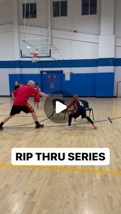 two men in red shirts are playing basketball on an indoor court with the words rip thru series