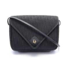 This Christian Dior Logo Crossbody Shoulder Bag Is A Stylish Addition To Any Outfit. The Bag Is Made Of High-Quality Black Leather And Features The Iconic Dior Logo Pattern. The Exterior Is Accented With A Canvas Handle/Strap Material That Adds A Unique Touch To The Design. The Bag Is Perfect For Women Who Love Fashion And Functionality. The Bag's Interior Is Lined With Soft Leather And Has Enough Space To Carry All Your Essentials. It Is A Great Choice For Any Occasion, Whether You Are Going To Christian Dior Crossbody Bag Black, Christian Dior Logo, Dior Logo, Vintage Bag, Logo Pattern, Bag Canvas, Love Fashion, Black Vintage, Vintage Bags