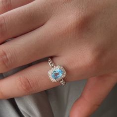 "❤ Genuine Blue Topaz Ring Basic Information ❀ Dainty blue topaz. ❀ Center Stone Size: 5x7mm. ❀ Metal Band Color ❀ Gold -- 18K gold plated sterling silver. ❀ Silver -- 18K white gold plated sterling silver. ❀ Rose Gold -- 18K rose gold plated sterling silver. ❤ 9K/14K/18K Solid Gold ❤ Please click the following links for 9K/14K/18K gold ring. www.etsy.com/listing/1412575630 ❤ Customized Top Ring ❀ Ring size is customized, US #2 till to US #16. ❀ Customize Engraved: Accept name or some simple ico Topaz Crystal Ring With Halo Setting Gift, Gift Topaz Ring With Cubic Zirconia Accents, Gift Topaz Ring With Cubic Zirconia And Gemstone Accents, Gift Crystal Topaz Ring With Halo Setting, Gift Topaz Crystal Ring With Halo Setting, Light Blue Oval Topaz Ring, Oval Light Blue Topaz Ring, Gift Blue Topaz Crystal Ring With Gemstone Accents, Blue Topaz Halo Ring For Anniversary