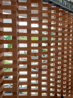 the inside of a building with wooden slats