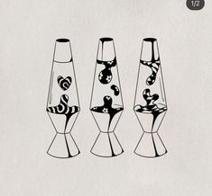 three vases with designs on them sitting next to each other