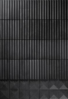 an abstract black and white photo with geometric patterns on the wall, as well as lines