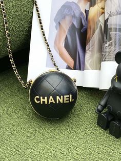 Description   CC Ball Bag Black and Gold Chain Bag For Women 23.5cm/9.25in  Rep 1:1  Size: 23.5 × 23.5 × 23.5 cm / 9.25 x 9.25 x 9.25 in  Gold chain  CC Logo  Black  Includes dust bag.  This product is of the best quality.