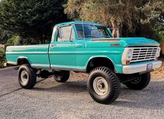 an old pick up truck is parked on the street