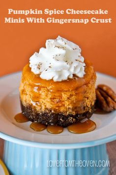 pumpkin spice cheesecake minis with gingermap crust on a blue cake plate