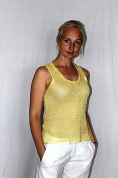 Knitted linen top from 100% linen light yellow in color. Size M All the items are knitted on hand knitting machines after patterns and the scissors are not used. After that they are washed and finishing is done by ironing. Taking care of the products containing 100% linen: Handwash or machine wash with 30 degrees and with gentle washing program. The poncho has to be dried naturally, laid out flat or on the hanger. It can be ironed with high temperature (desirably on the inside of the garment). I Linen Tops, Linen Top Women, Knitting Machines, Linen Lights, Linen Sweater, Linen Clothing, Summer Linen, Yellow Blouse, Modern Outfits