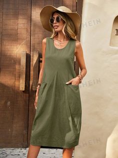 Effortlessly elevate your wardrobe with our Double the Chic: Solid Dual Pocket Curved Hem Tank Dress. This versatile dress features not one, but two pockets, perfect for keeping your essentials close by. The curved hem adds a unique touch to this solid colored dress, making it a must-have for any fashion-forward individual. Color : Army Green Style : Casual Details : Pocket Type : Tank Pattern Type : Plain Sleeve Length : Sleeveless Neckline : Scoop Neck Waist Line : Natural Hem Shaped : Straigh Casual Cotton Midi Dress In Solid Color, Casual Cotton Midi Dress Solid Color, Casual Solid Color Cotton Midi Dress, Casual Solid Color Dresses With Pockets, Casual Solid Dresses With Pockets, Summer A-line Midi Dress With Pockets, Longline Midi Dress For Summer, Cotton Shift Midi Dress In Solid Color, Cotton Solid Color Midi Dress For Work