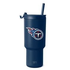 the tennessee titans travel tumbler is shown with a straw in it's mouth