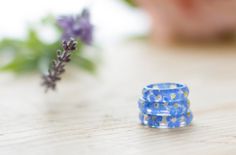 Forget me not flowers, set in crystal clear resin - truly magical! They are about 5mm wide, so they look wonderful on their own, or as chunky stacking rings. Wear this ring and literally have summer in the palm of your hand... the second to last photo shows a tiny selection of the matching forget me nots jewellery we make. To find your ring size, measure the circumference of your finger, and use the chart (last photo) to find your size. Alternatively, measure the inside circumference of a ring y Adjustable Blue Flower Ring For Gifting, Adjustable Blue Flower Ring Gift, Blue Resin Rings Perfect As Gifts, Blue Resin Rings For Gifts, Blue Resin Rings Perfect For Gifts, Handmade Blue Flower Ring, Blue Flower Resin Jewelry, Real Flower Ring, Blue Ring