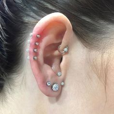 a woman with ear piercings on her ears