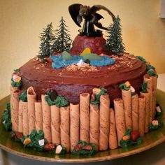 a cake decorated with wine corks and an image of a man riding a horse