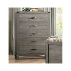 a gray dresser with drawers and a bed in front of a window on top of a hard wood floor