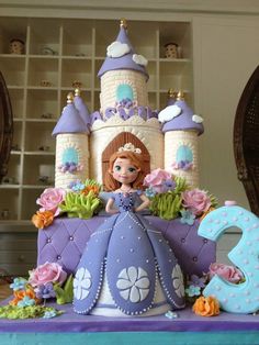 there is a cake that looks like a castle with a princess on top and flowers around it