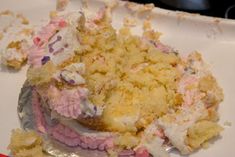 a half eaten piece of cake sitting on top of a white plate