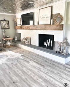 a living room filled with furniture and a fire place