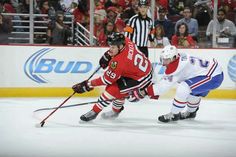 two hockey players on the ice during a game