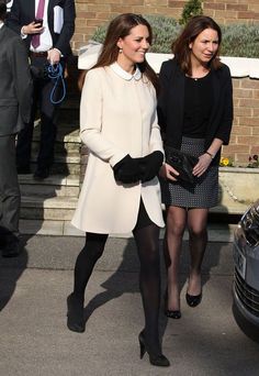 two women in black and white are walking together