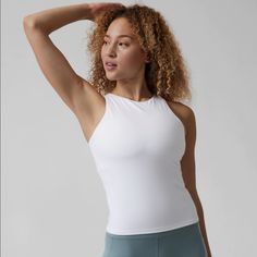 Nwt Athleta Conscious Support Top In White. Brand New. Only Tried On A Few Times. Buttery Soft Workout Top With Built In Bra With Light Padding. I Did Get A Makeup Mark On Neckline As Shown In Picture. Should Come Out In Wash- I Just Did Not Want To Wash It Myself Before Selling. Tank Top With Built-in Bra For Pilates, Sleeveless Sportswear Tops With Built-in Bra, White Athleisure Top With Built-in Bra, Sleeveless Tops With Built-in Bra For Light Exercise, High Stretch Tank Top For Athleisure, Athletic Fit Racerback Top For Summer, Sporty Sleeveless High Stretch Top, Sporty High Stretch Sleeveless Tops, Racerback Athleisure Top For Yoga