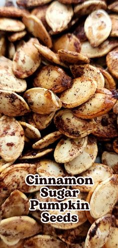 cinnamon sugar pumpkin seeds on a white plate with the words, cinnamon sugar pumpkin seeds