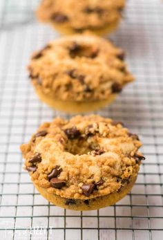 baked chocolate chip donuts on a cooling rack with the words baked cake donuts above them