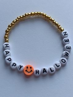 Gold seed bead bracelet theat says happy Halloween  Please do not stretch it. Each one is handmade and if stretched to far it could lose its shape. If you need any assistance at all please do not hesitate to message me. I am always more than happy to help. Hope you enjoy shopping  With me. Halloween Seed Bead, Bracket Ideas, Bracelets Tutorial, Ideas For Halloween, Beaded Bracelets Tutorial, Seed Bead Bracelet, Clay Bead, Bracelet Ideas, Bead Bracelets