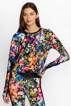 Adorned with bursting floral blooms, the Wild Bloom Long Sleeve Step Hem Tee offers an extra layer of warmth to your gym ensemble. Featuring a high rounded neckline and a fitted silhouette, this long sleeve tee is an easy layer that won't get in the way of your workout. Pair with classic leggings and a comfortable sports bra for a workout-ready look. Johnny Was Women's Bee Active Long Sleeve Step Hem T-Shirt With Keyholes in Wild Bloom Pink, Size XS, Floral Jade Dress, Women's Blouses, The Bee, Chic Outfit, Rounded Neckline, Embroidered Jeans, Fitted Silhouette, Johnny Was, Long Sleeve Tee